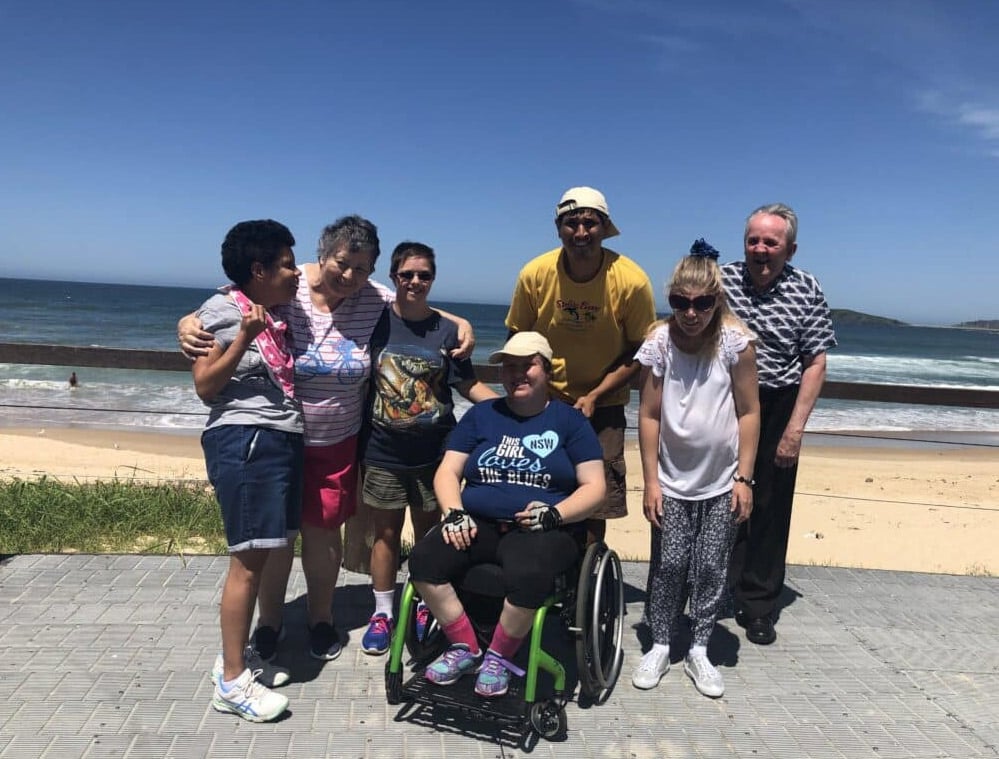 A Group Of People With Disability On A Beach Trip