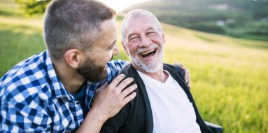 Son with senior father in wheelchair — Disability Support Services in Coffs Harbour, NSW