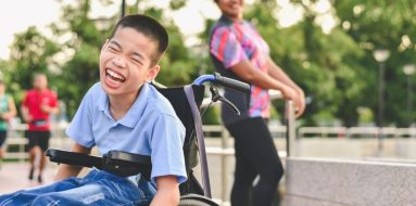Young boy with disability having fun while outdoors — Disability Support Services in Maitland, NSW