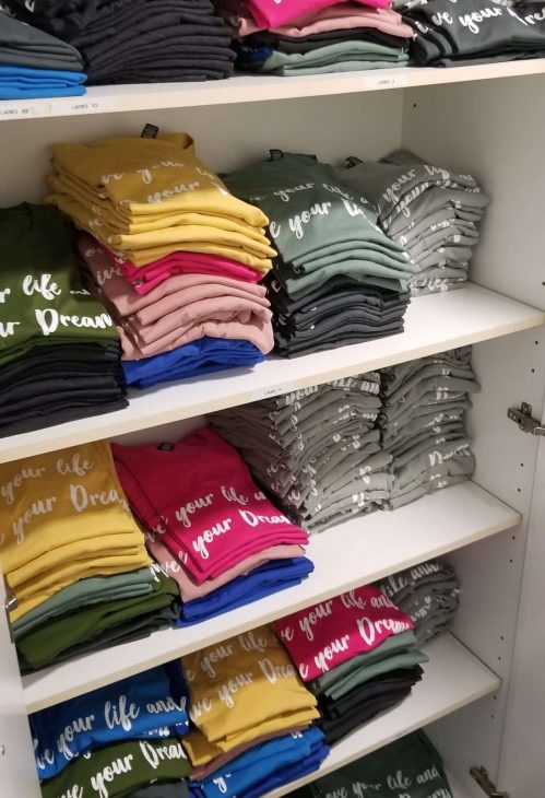 UDC t-shirts in a cupboard