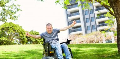 Man on a motorized wheelchair — Disability Support Services in Brisbane, QLD