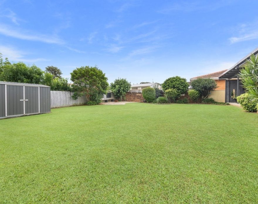 SIL housing with green backyard