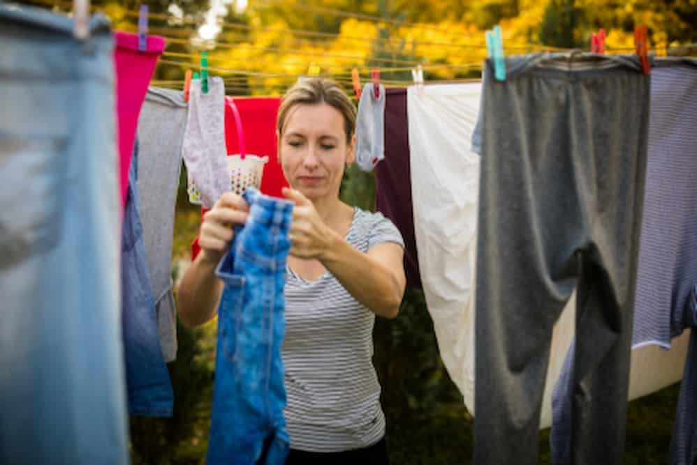 Woman Doing Laundry — Disability Support Services in Robina, QLD