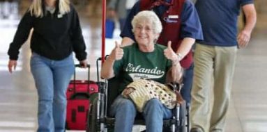 Smiling old lady on a wheelchair — Disability Support Services in Robina, QLD